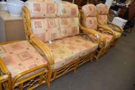 BAMBOO FRAMED FOUR PIECE CONSERVATORY SUITE COMPRISING TWO SEATER SOFA, PAIR OF ARMCHAIRS AND