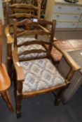 A PAIR OF LADDER BACK CARVER CHAIRS