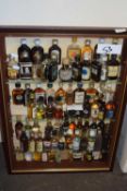 DISPLAY CABINET CONTAINING VARIOUS MINIATURE BOTTLES OF SPIRITS