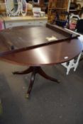 REPRODUCTION MAHOGANY SINGLE PEDESTAL DINING TABLE WITH EXTENSION LEAF