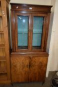 EARLY 20TH CENTURY TWO SECTION DISPLAY CABINET WITH WALNUT VENEERED BASE DOORS