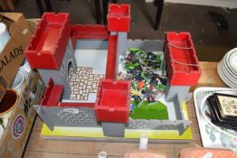 PAINTED WOODEN FORT AND ACCOMPANYING PLASTIC SOLDIERS