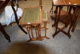 NEST OF THREE OCCASIONAL TABLES WITH LEATHER TOPS