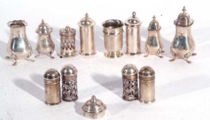 Group of thirteen silver peppers, various dates and makers, 340 grams