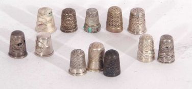Group of nine hallmarked silver thimbles and three other metal examples
