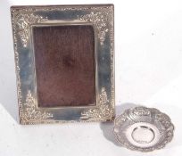 Mixed lot to include Elizabeth II silver photograph frame embossed with flowers and ribbons, easel
