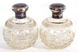 Pair of George V scent bottles of globular form having cut glass bodies and hinged inlaid