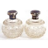 Pair of George V scent bottles of globular form having cut glass bodies and hinged inlaid