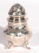 Continental white metal pepper of ballister form having an embossed pierced pull off lid floral leaf