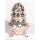 Continental white metal pepper of ballister form having an embossed pierced pull off lid floral leaf