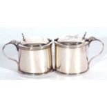 Small pair of George V drum mustards with looped handles, hinged lids, complete with blue glass