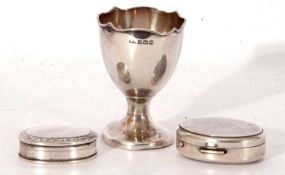Mixed Lot: a 20th century Birmingham hallmarked silver egg cup, together with two oval white metal