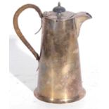 Hallmarked silver hot water jug of tapering form, the hinged lid with an ebonised urn finial
