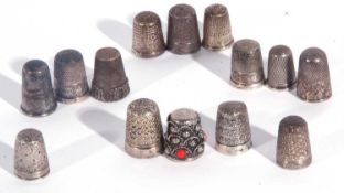 Group of thimbles to include eight silver examples and six others