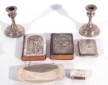 Mixed lot to include two common prayer books each applied with a silver mount, a hallmarked silver