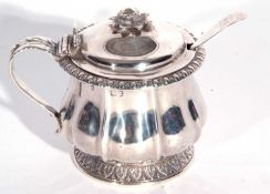 George IV silver mustard pot of circular octagonal form with a leafed cap, scrolled handle, dome