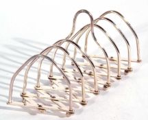 Unusual expanding silver plated toast rack with six lancet shaped divisions, engraved to base with