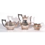 Edward VII silver three piece tea set of oval panelled form comprising of a coffee pot, teapot, both