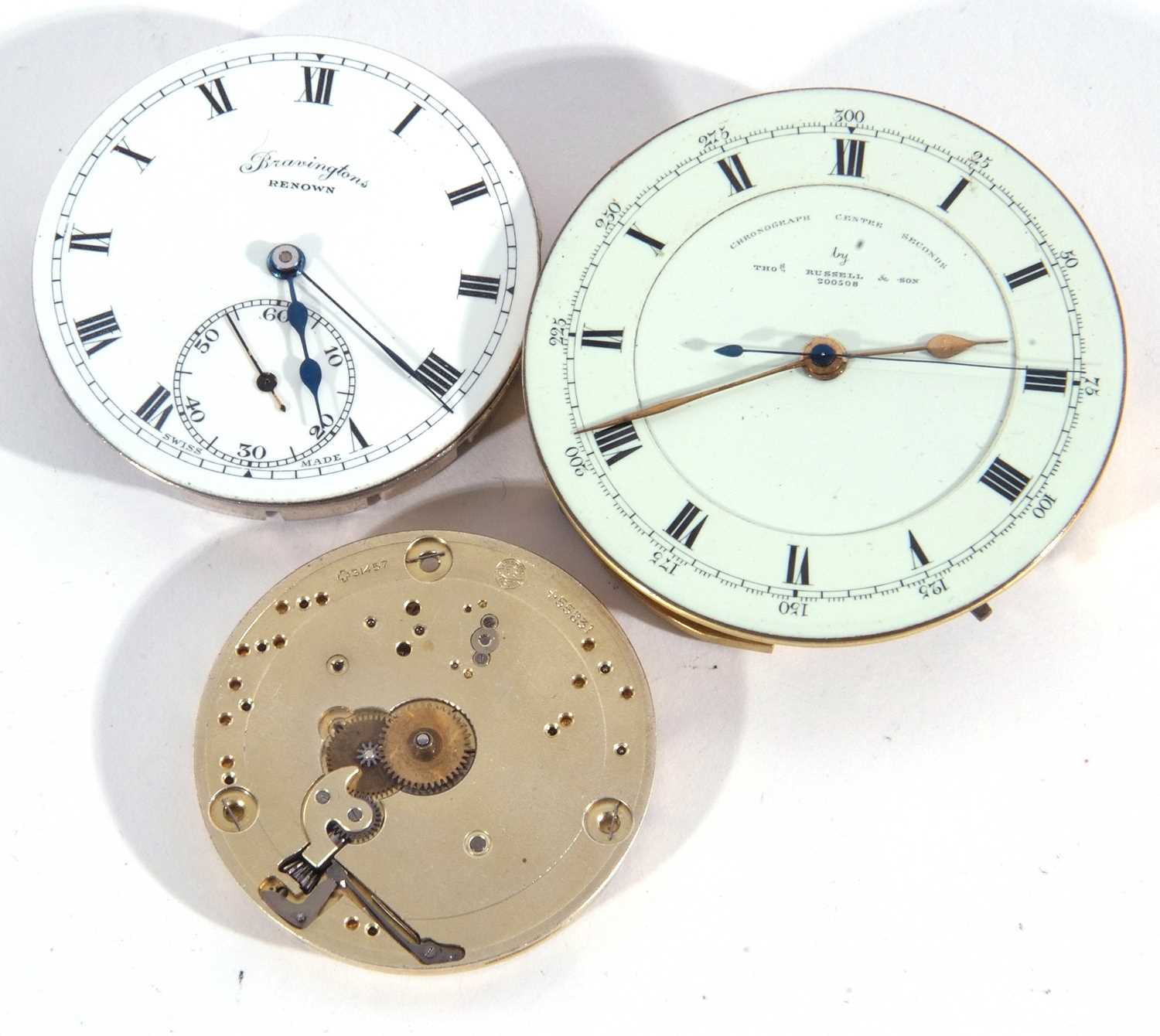 Lot of three pocket watch movements and dials, one by Thomas Russell & Sons complete with white