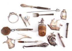 Mixed lot to include white metal oddments, a figural bottle stopper, pencils, a Turkish jug