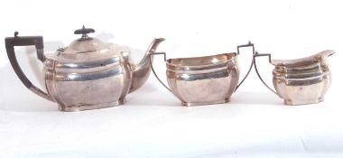 George V silver three piece tea set of plain form with cantered corners comprising teapot, twin