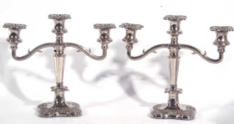 Pair of silver plated three branch candelabra, 25 cm tall