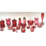 Quantity of cranberry glass wares including salts, jars and covers and vases, also morler mug with