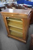 Victorian rosewood and inlaid pier cabinet with single glazed door raised on short turned legs, 75cm
