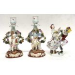 Pair of Continental porcelain candleholders and other Continental porcelain figures including a