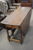 18th century oak drop leaf dining table raised on turned legs with base stretchers fitted with end