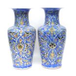 Pair of Persion Iznik vases, blue ground with floral decoration (2) 42 cm high