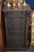 19th Century stained pine Wellington chest with seven graduated drawers raised on a plinth base,