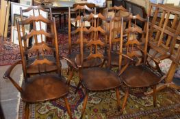 Unusual set of six Ercol stick and bar back dining chairs comprising two carvers and four standard