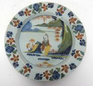 An English delft plate with polychrome chinoiserie design23cmbroken and re-stuck