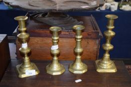 Two pairs 19th Century brass candlesticks, the largest are 23 cm high (4)