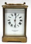 Brass carriage clock with white enamal dial, retailed by Birch & Gaydon, London with French