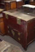 Unusual Chinese elm and brass bound cabinet, the top with two lifting hinged lids over two covered