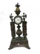 Small bronzed Empire style clock with pineapple finial (crack to enamel dial)