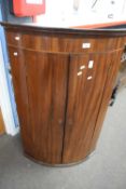 Georgian mahogany two-door bow front wall mounted corner cabinet with shelved interior and three