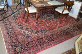 Large 20th Century Iranian floor rug decorated with red central medalion surrounded by floral and