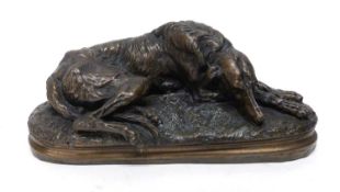 After Paul Joseph Raymond Gayrard, a bronzed sculpture of a reclining deerhound signed Gayrard,