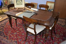Late Victorian mahogany extending dining table raised on turned legs with castors together with a