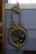 20th Century circular beveled wall mirror in an abstract painted and gilt finish frame with