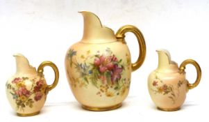 A group of three Worcester blush ground jugs, various sizes decorated with flowers, 3 in the lot