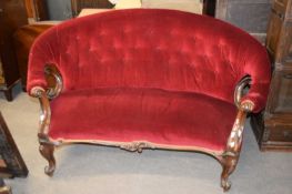 Victorian mahogany framed bow back sofa with red buttoned upholstery raised on short cabriole