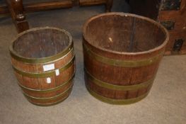 Two oak and brass bound barrel formed jardinieres, the largest 35cm diameter (2)