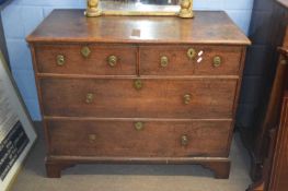 Georgian oak chest of two short and two long drawers raised on bracket feet fitted with ringlet