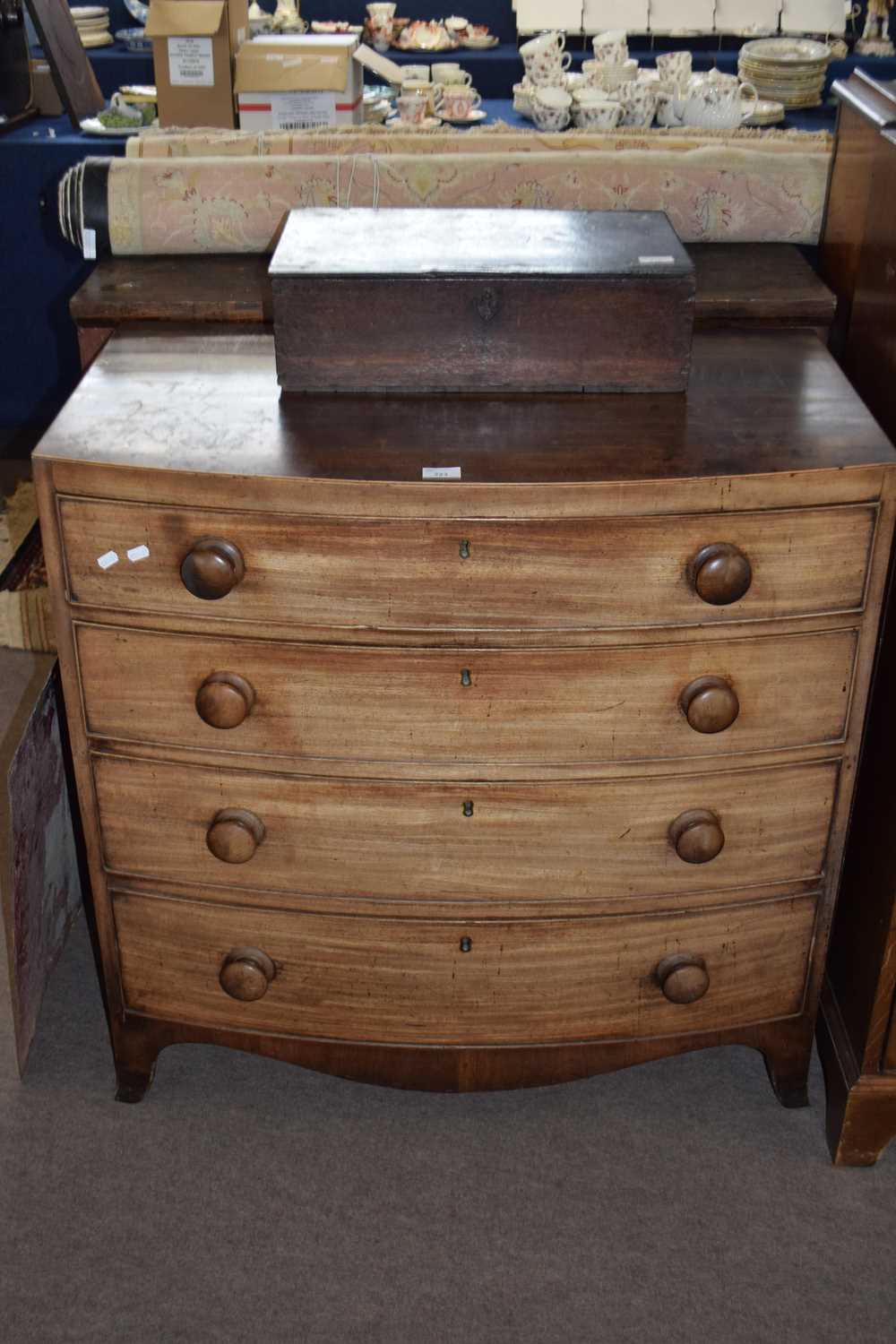 19th Century mahogany bow front chest of four graduated drawers raised on outswept legs