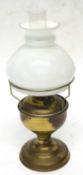 A small brass oil lamp with shade