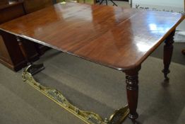 Victorian mahogany dining table of rectangular form raised on turned legs with casters, 175cm long